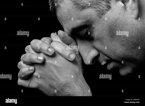 Close Up Of Faithful Mature Man Praying Hands Folded Worship God Head