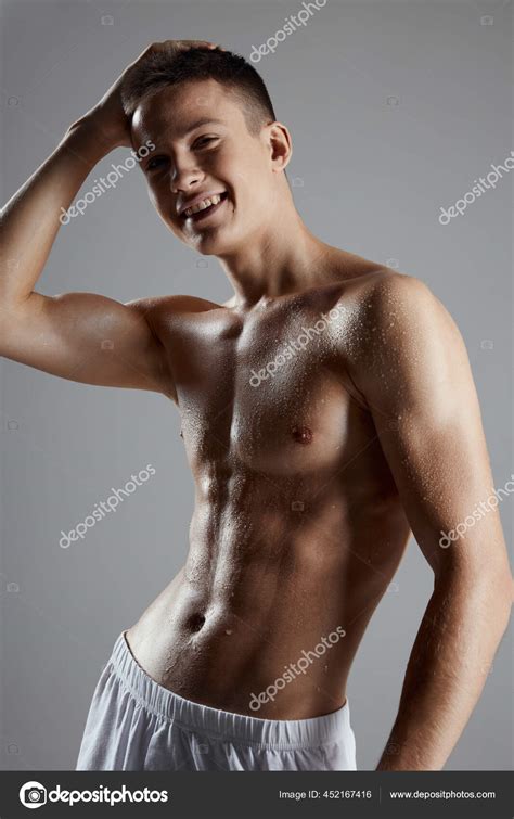 An Athlete In White Shorts And With A Naked Torso Holds His Hand On His Head Stock Photo