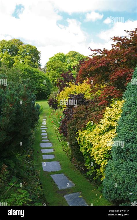 Narrow Path Leading To The Tennis Court Garden At The Garden House At