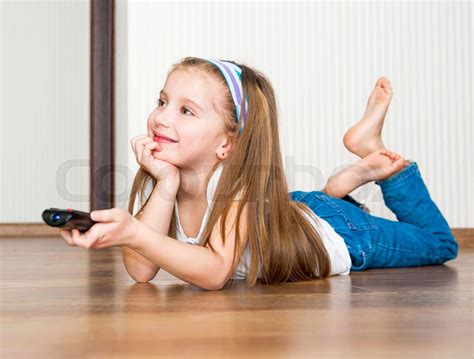 Girl Holding A Remote Control Stock Image Colourbox