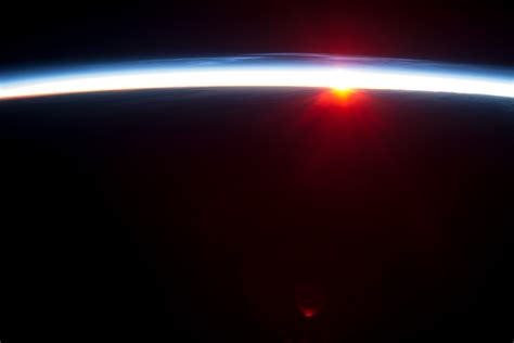 Sunrise from the ISS above Alaska on - Photorator