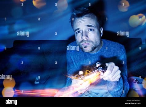 Man Playing Video Games At Night Stock Photo Alamy