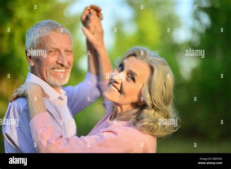 Portrait Of Beautiful Caucasian Senior Couple In The Park Danci Stock