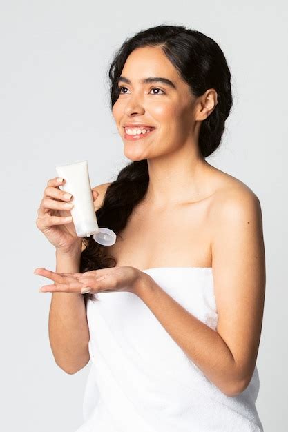 Premium Photo Beautiful Woman Holding A Skin Care Product