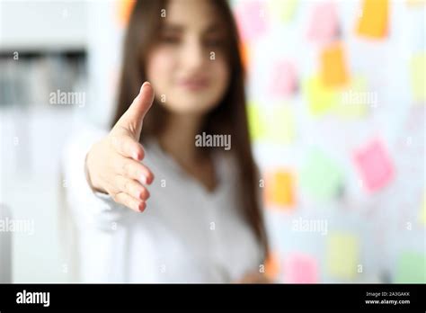 Cheerful Female Clerk Welcoming Business Partner Stock Photo Alamy