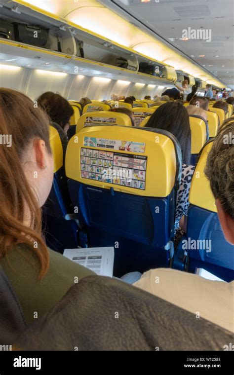 Passengers Inside The Cabin Of A Ryanair Boeing 737 Jet Plane Stock