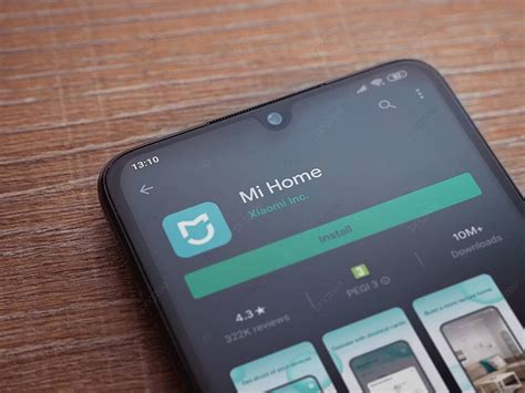 هاتف ذكي أسود اللون يعرض صفحة متجر تطبيقات Mi Home صورة الخلفية والصورة