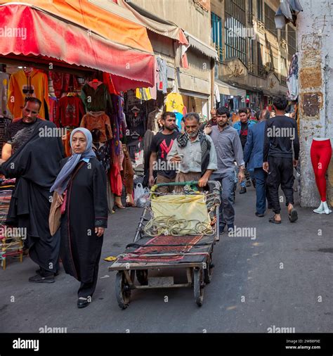 Local People Walk Along A Narrow Street In The Grand Bazaar Area In