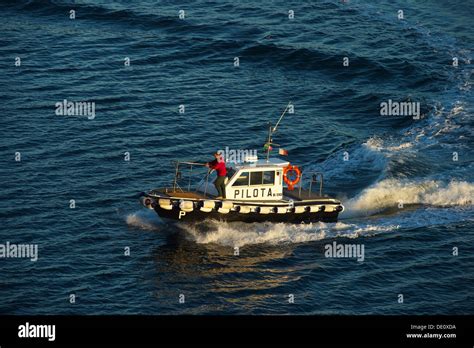 Pilot boat from the port authorities approaching with pilot getting ...