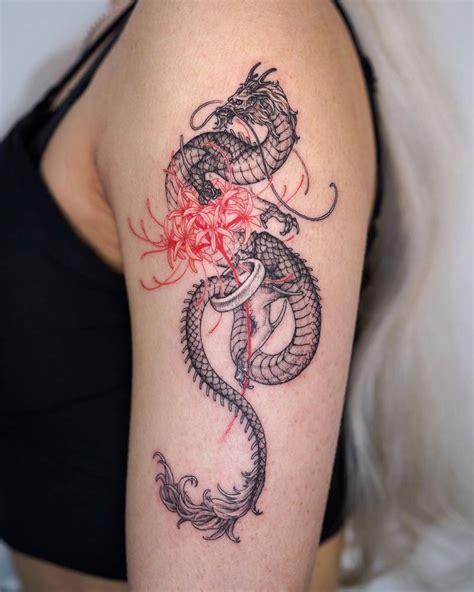 Dragon and red spider lily tattoo done on the upper