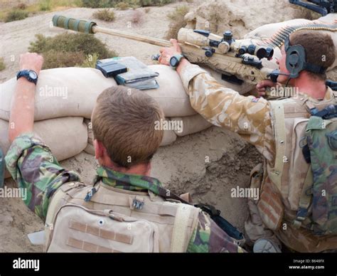 British Army Snipers Looking Through Sniper Rifle Sight In Helmand