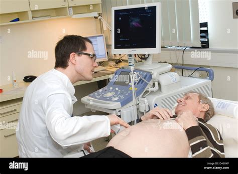 A Doctor Checks A Monitor After Performing An Endoscopic Procedure On A