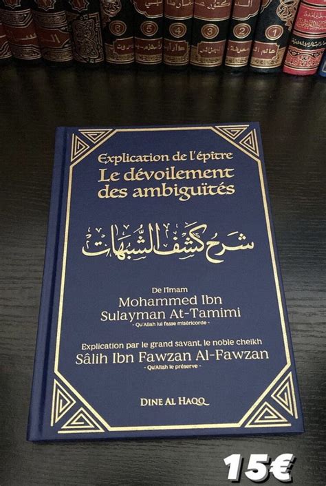 A Book With Arabic Writing On It Sitting On A Table In Front Of Bookshelves