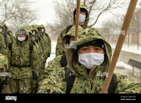 A Recruit Waits For Instruction While Her Division Reconfigures Their