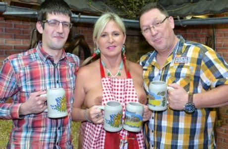 Thick Blonde Serves Beer With Big Boobs Out After Putting In Wood In The Nude PornPics