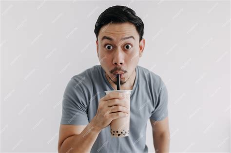 Premium Photo Man Drinking Boba Tea Or Bubble Tea Deliciously