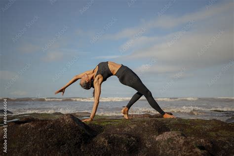 Bali Yoga Asian Woman Practicing Chakrasana Or Urdhva Dhanurasana