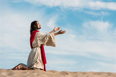 Group Praying On Knees