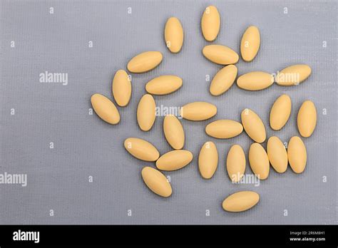 Oval Shaped Tablets Lie On A Contrasting Background Stock Photo Alamy