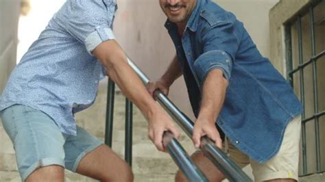 Gay Couple Holding On To Railing Of Stai Stock Video Pond