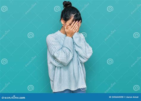 Young Hispanic Woman Wearing Casual Clothes With Sad Expression