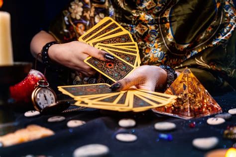 The Fortune Teller Holds A Glass Pyramid With Gold In Her Hands And