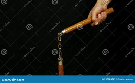 Man S Hand Holding A Nunchaku In His Hand Stock Image Image Of Arms