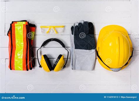 Standard Construction Safety Equipment On Yellow Background Top View