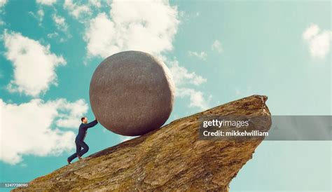 Man Pushing Rock Up Hill