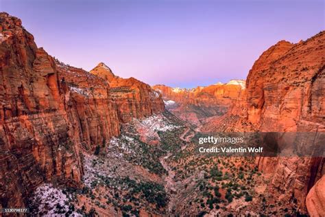 View From Canyon Overlook Into Zion Canyon With Snow At Sunrise Back