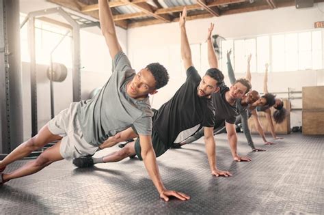 Premium Photo Fitness Exercise And Training With A Sports Group Stretching Together In Gym