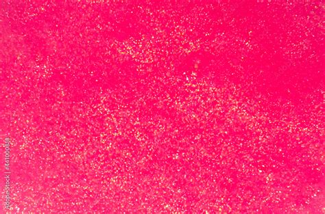 Saturated pink slime with golden glitter particle texture, top view. Stock Photo | Adobe Stock