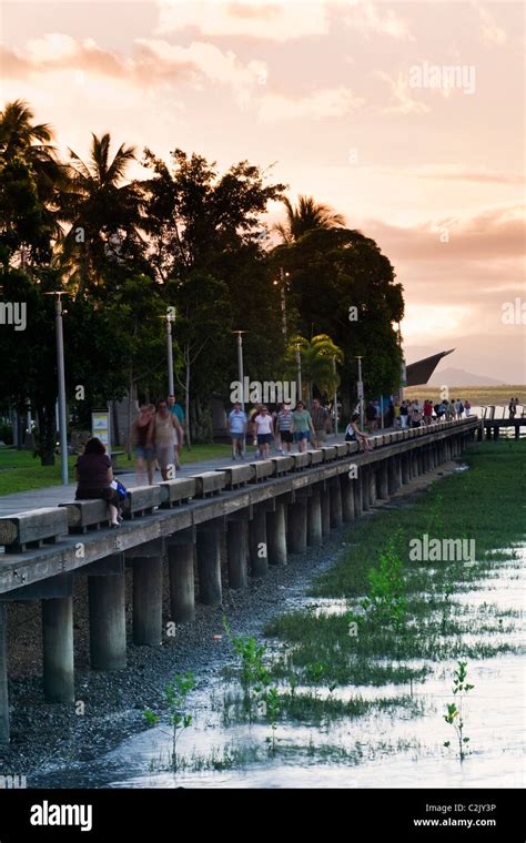 View along the Esplanade boardwalk at dusk. Cairns, Queensland ...