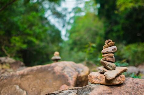 Premium Photo Close Up Of Stone Stacked On Rock In Forest