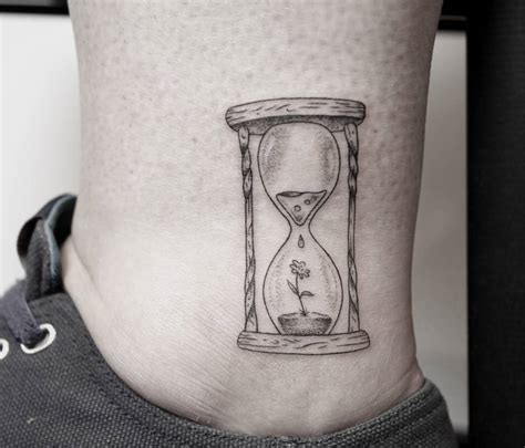 Tiny Hourglass Tattoo By Pablo Torre