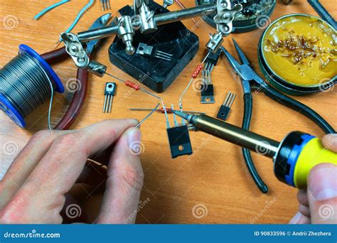 Hands Holding Soldering Iron And Solder Wire Stock Photo Image Of