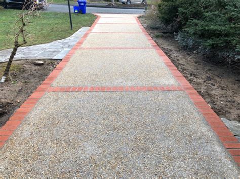 Exposed Aggregate Concrete Driveway With Brick Paver Border In Silver