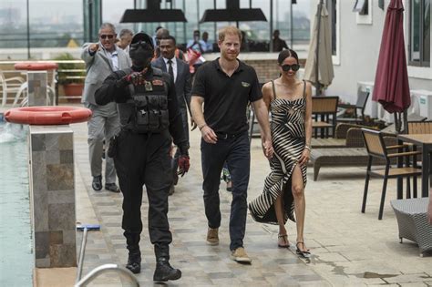 Meghan Markle And Prince Harry Pose For Selfies With Fans During Second Day Of Nigeria Tour