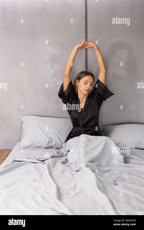 Woman Stretching In Bed After Wake Up Stock Photo Alamy