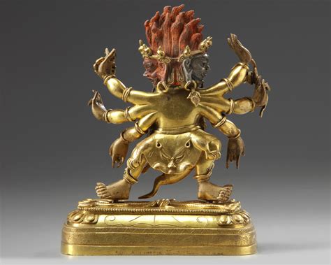 A Tibetan Gilt Bronze Six Armed Mahakala