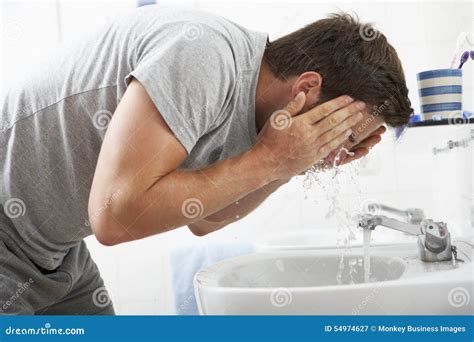 Man Washing Face In Bathroom Sink Stock Image Image Of Bathroom