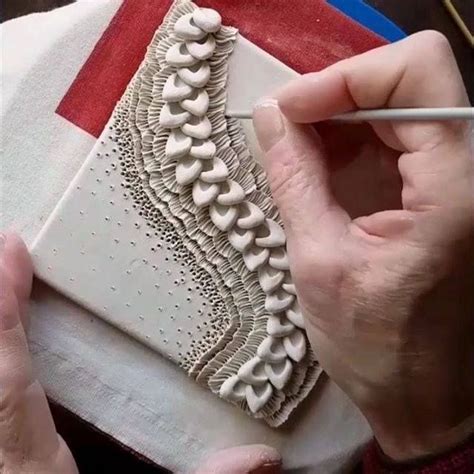 Someone Is Working On An Intricate Piece Of Art That Looks Like