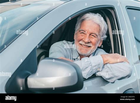 Happy Owner Looking At The Camera With Happy Face Handsome Bearded Mature Man Sitting Relaxed