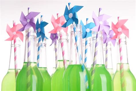 Premium Photo | Bottles of drink with straw isolated on white