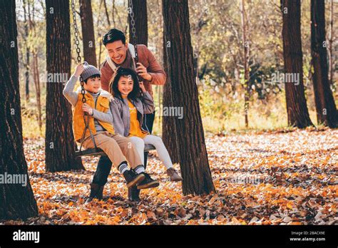 Happy family playing outside Stock Photo - Alamy