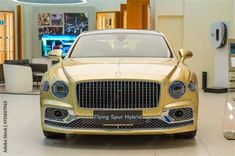 Gold Bentley Flying Spur Azure Hybrid Sustainable Energy Mulliner