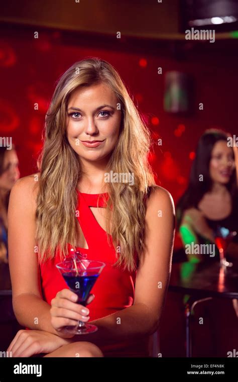 Pretty Blonde Drinking A Cocktail Stock Photo Alamy