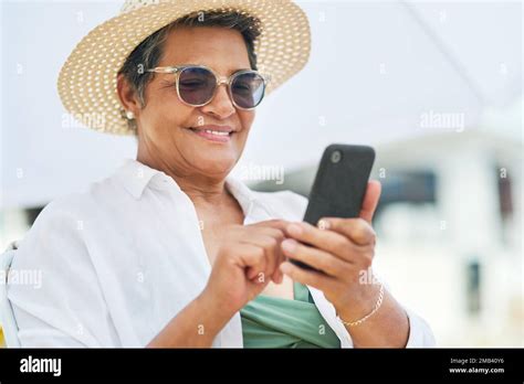 Im Definitely Up To Date With Technology A Mature Woman Sitting Alone