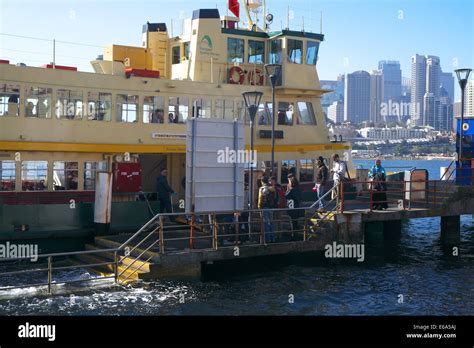 sydney ferry meets passengers at balmain east ferry wharf with city in ...