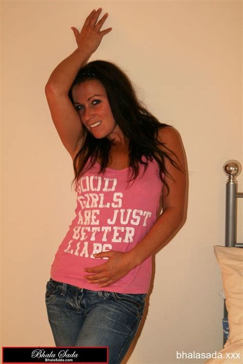 Sweet Brunette Chick Loves Posing Fully Clothed In The Bedroom 15 Photos